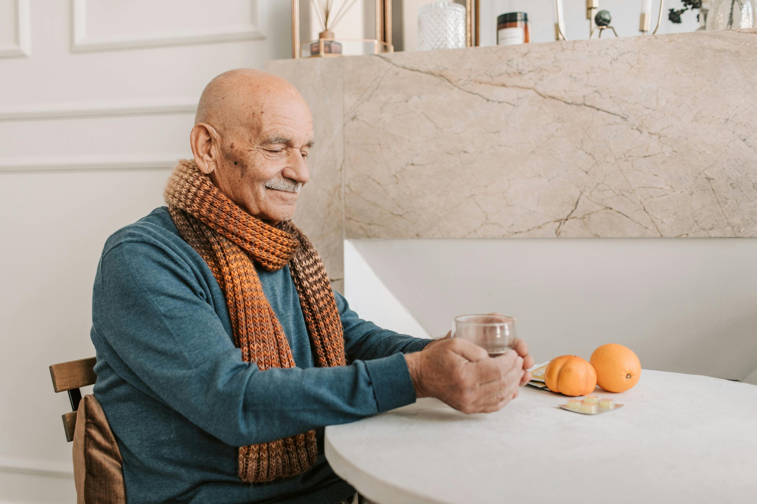 senior man drinking a warm cup of tea